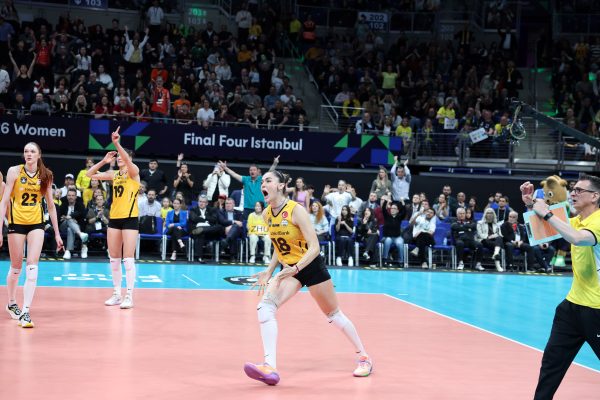 Volleyball players in yellow jerseys sprint on a bright court while a packed arena cheers at Final Four Istanbul.